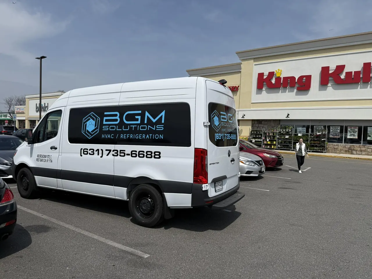 BGM service van parked outside a supermarket